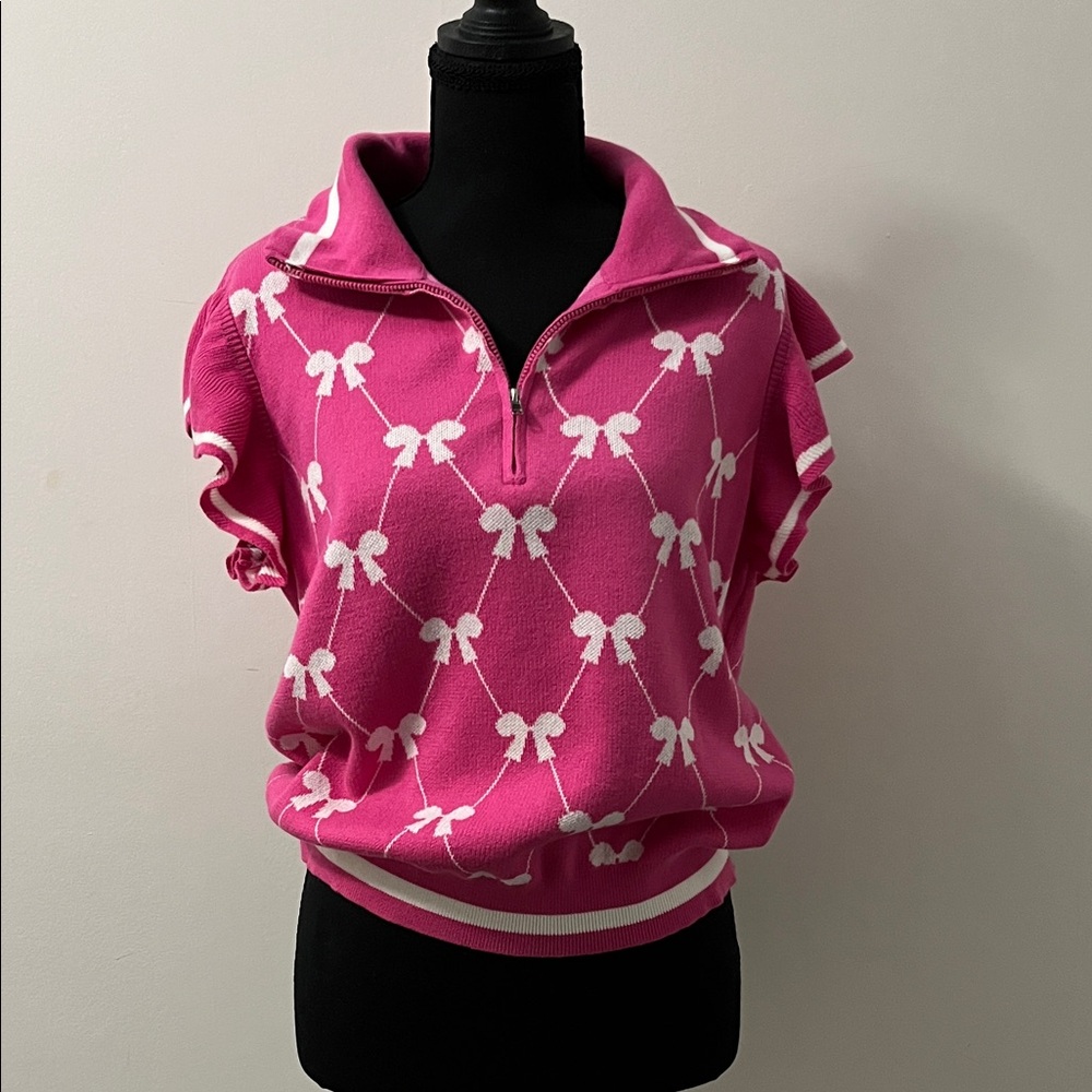 Amazon Pink V-Neck Sweater with White Bow Pattern